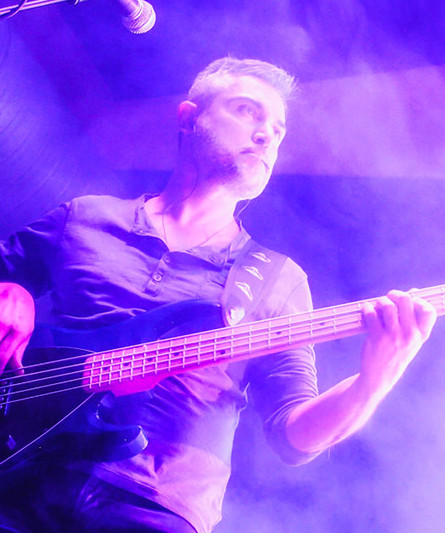 Slap Is Dead playing bass on stage